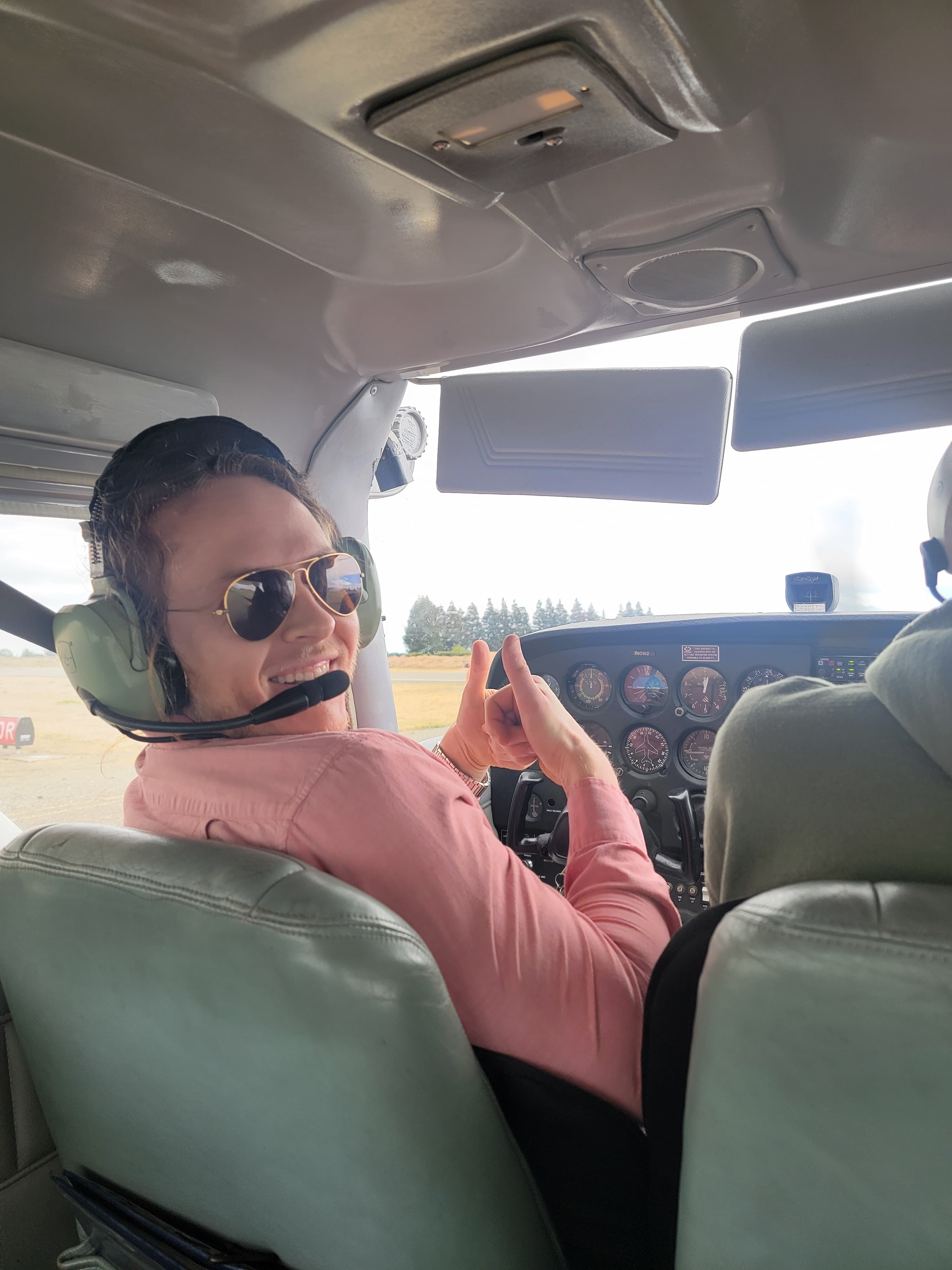 Kyle James DeProw in an airplane cockpit